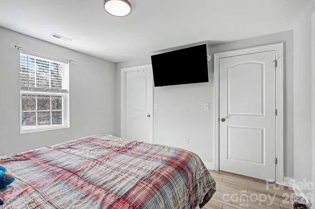 a view of hallway with livingroom and furniture