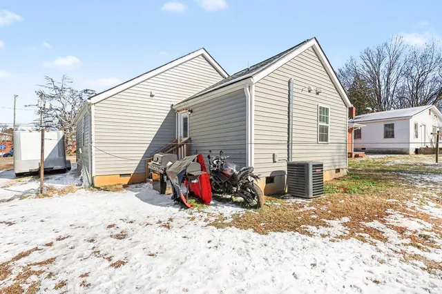a view of houses with outdoor space and parking