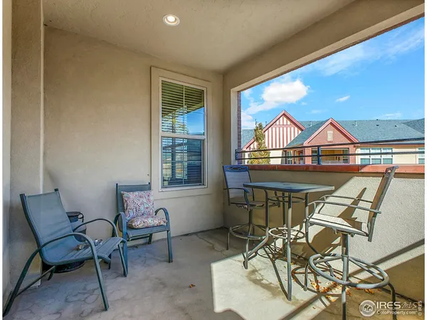 a view of a chairs and table in patio