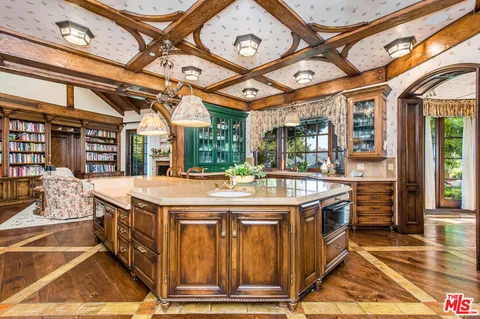 a kitchen with a stove and a microwave oven