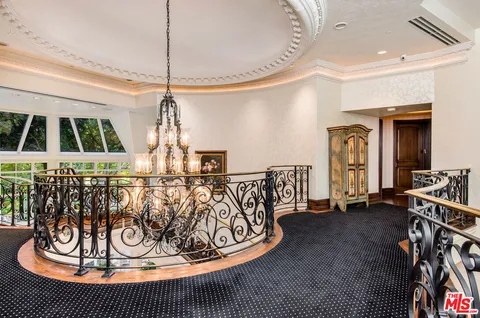 a view of a entryway door with table and chairs