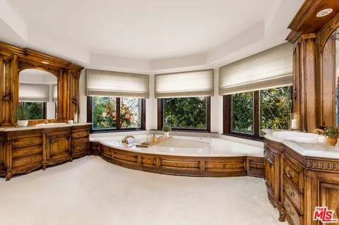 a living room with furniture a window and a fireplace