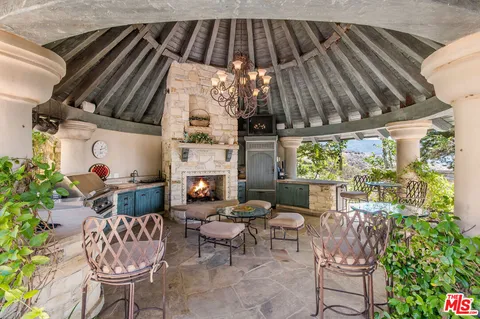 a view of a swimming pool and lounge chair