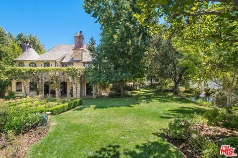 a view of field with trees in the background
