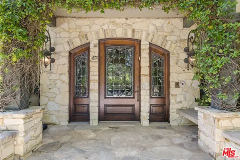 an entrance to house with yard