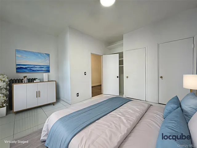 a bedroom with a bed and a couch