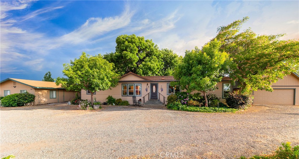a front view of a house with a yard and a garage