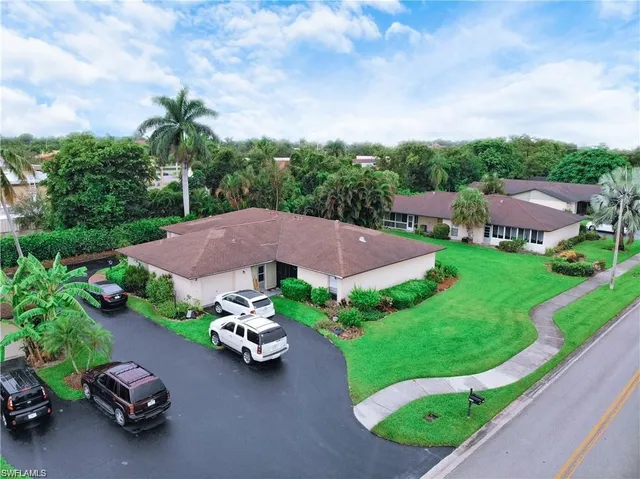 a view of a garden with lawn chairs