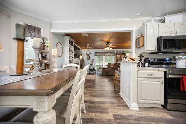 a kitchen with stainless steel appliances granite countertop a stove and a sink