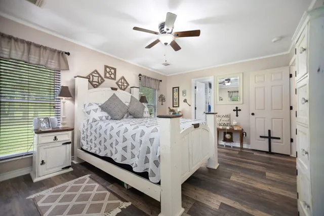 a bed room with a bed and a chandelier