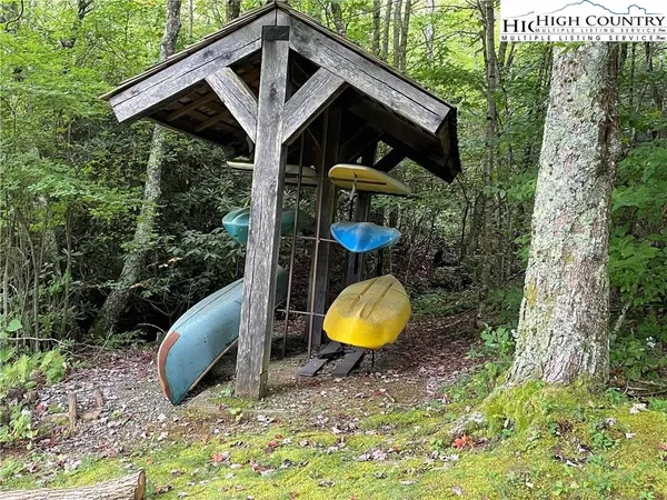 a view of a wooden house with a swimming pool