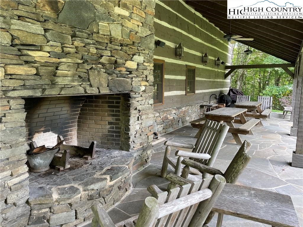 Wolfsbane Trail Todd, NC 28684 - Photo 25 of 29 a view of a patio with couple of chairs and a fire pit