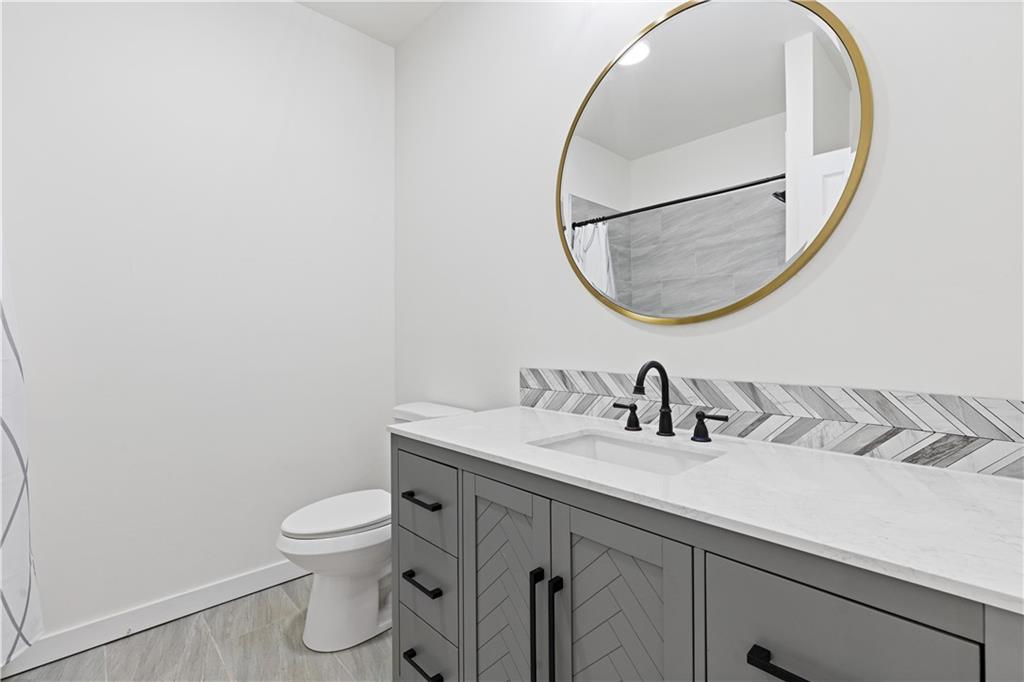 3272 Corktree Trail Lithonia, GA 30038 - Photo 16 of 22 a bathroom with a sink and a mirror