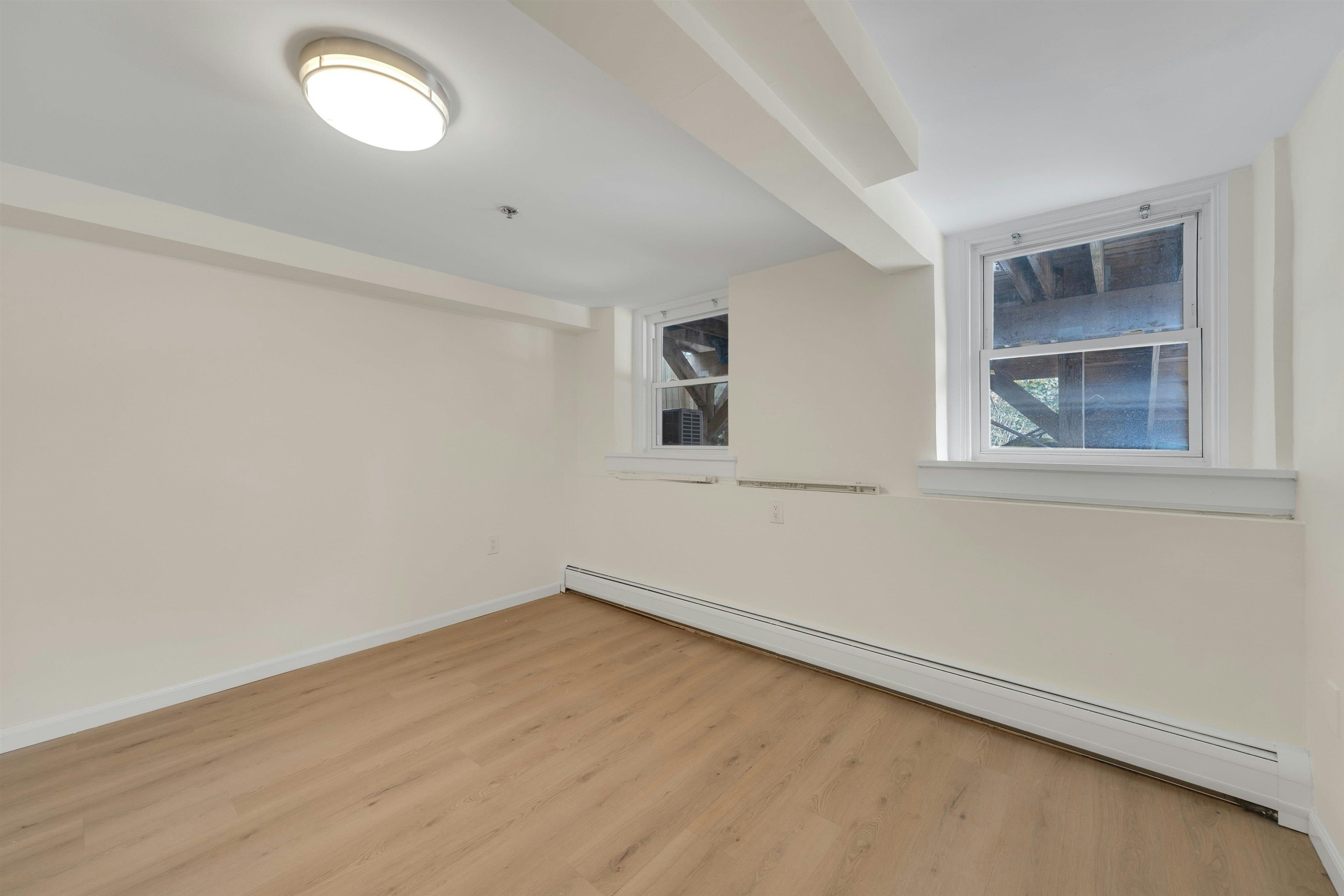 722 27th Street, Unit G Union City, NJ 07087 - Photo 11 of 25 an empty room with a window