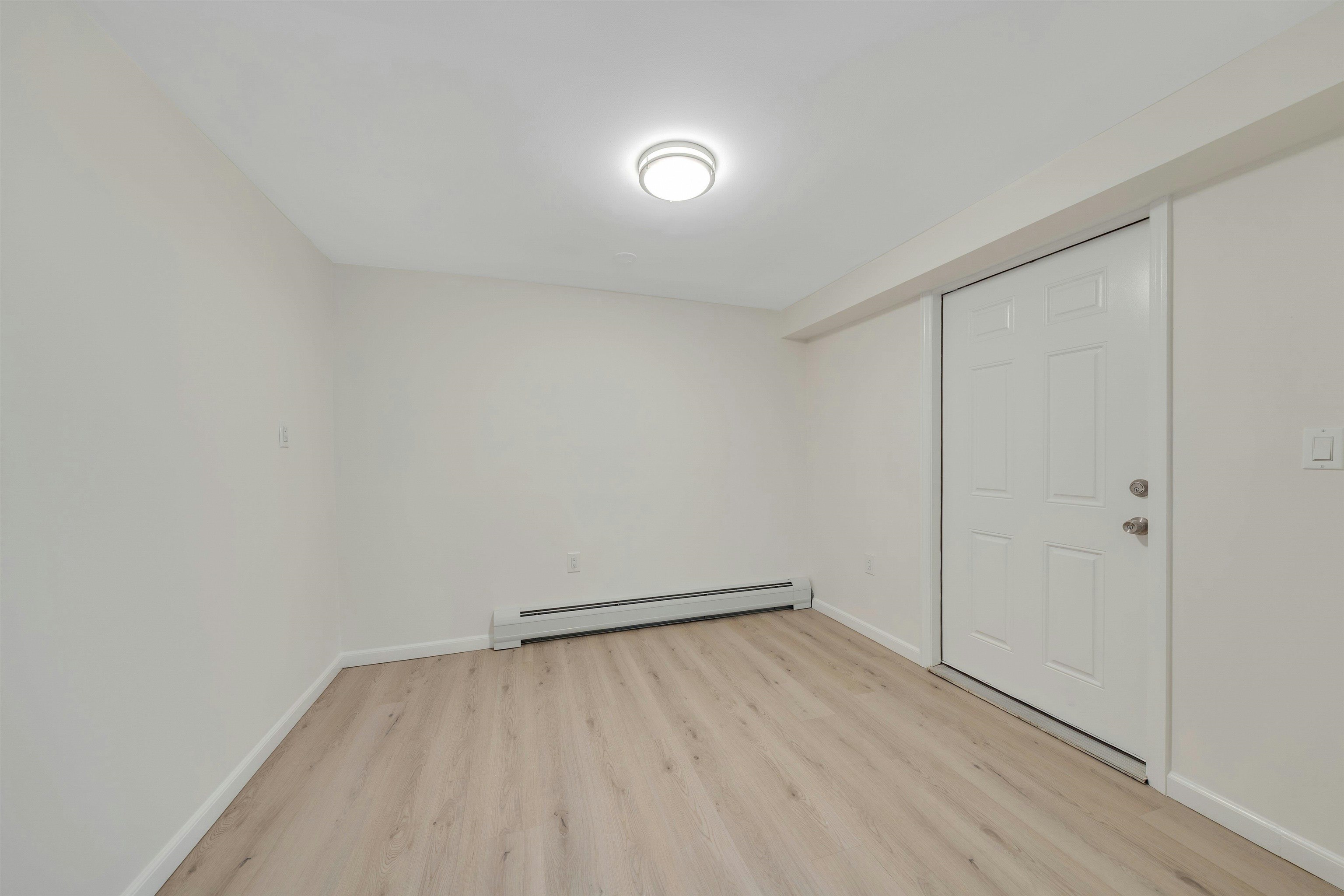 722 27th Street, Unit G Union City, NJ 07087 - Photo 12 of 25 wooden floor in an empty room