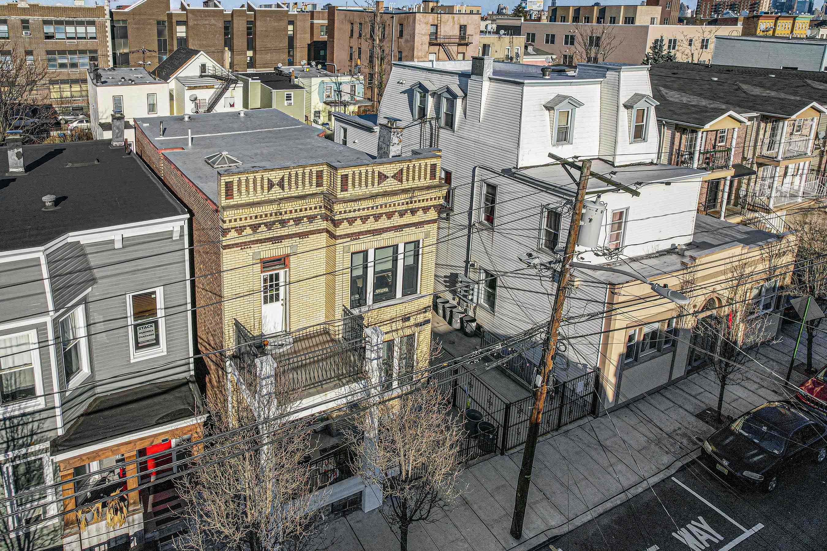 722 27th Street, Unit G Union City, NJ 07087 - Photo 17 of 25 an aerial view of a residential apartment building with a yard