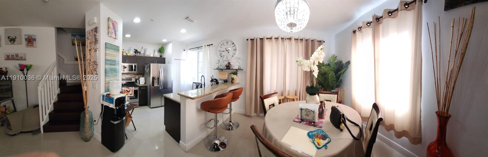 12430 Southwest 50th Street, Unit 147 Miramar, FL 33027 - Photo 2 of 14 a view of a room with gym equipment