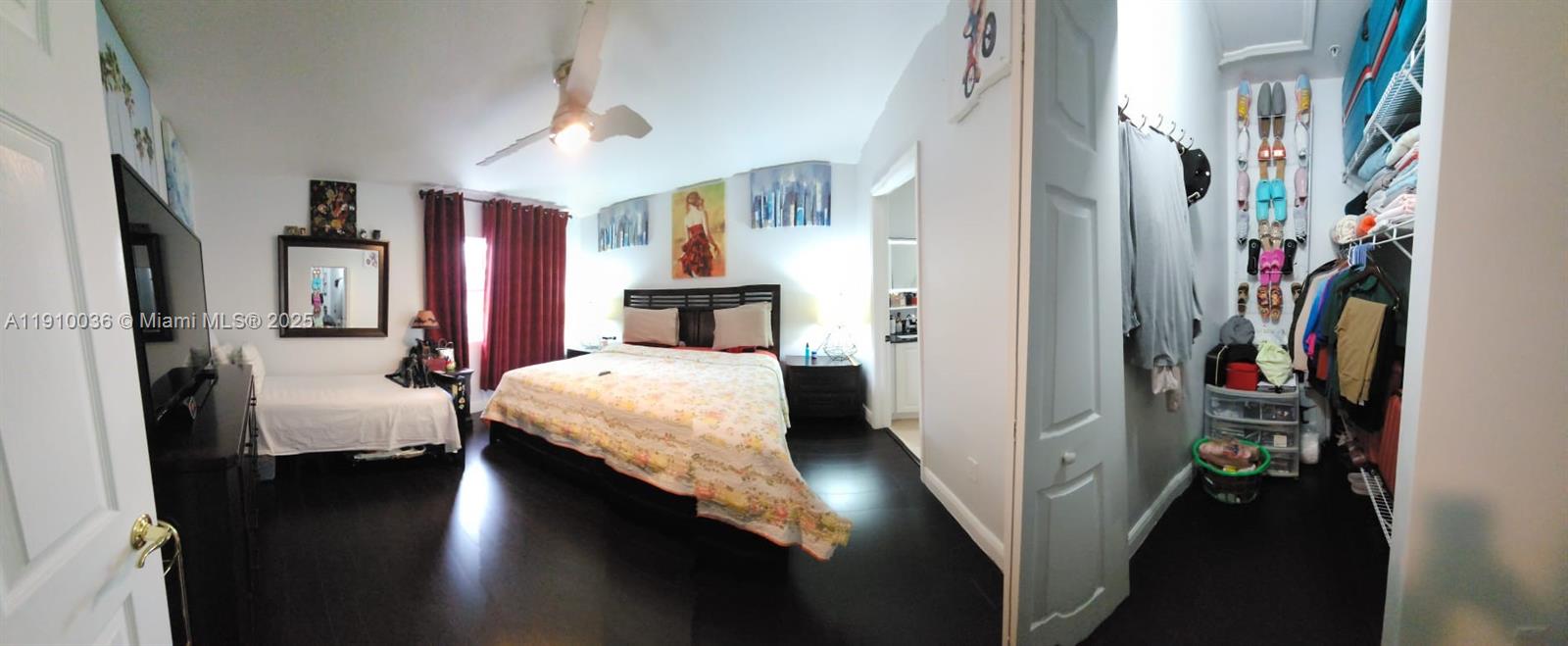 12430 Southwest 50th Street, Unit 147 Miramar, FL 33027 - Photo 7 of 14 a bedroom with a bed and a large mirror