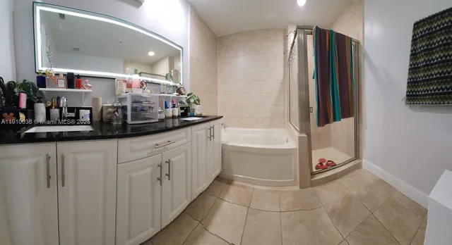 a kitchen with a refrigerator and countertop