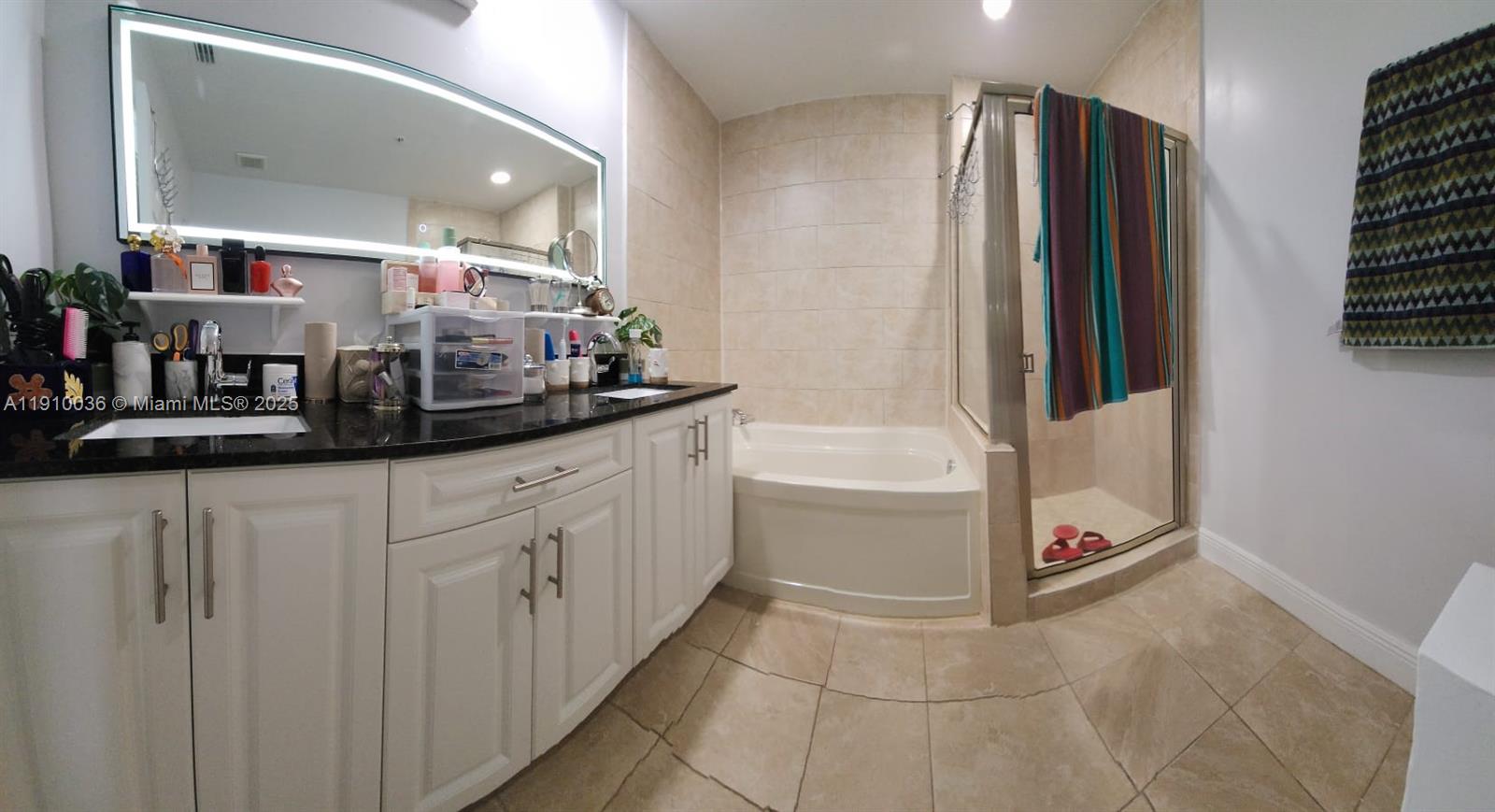 12430 Southwest 50th Street, Unit 147 Miramar, FL 33027 - Photo 8 of 14 a kitchen with a refrigerator and countertop