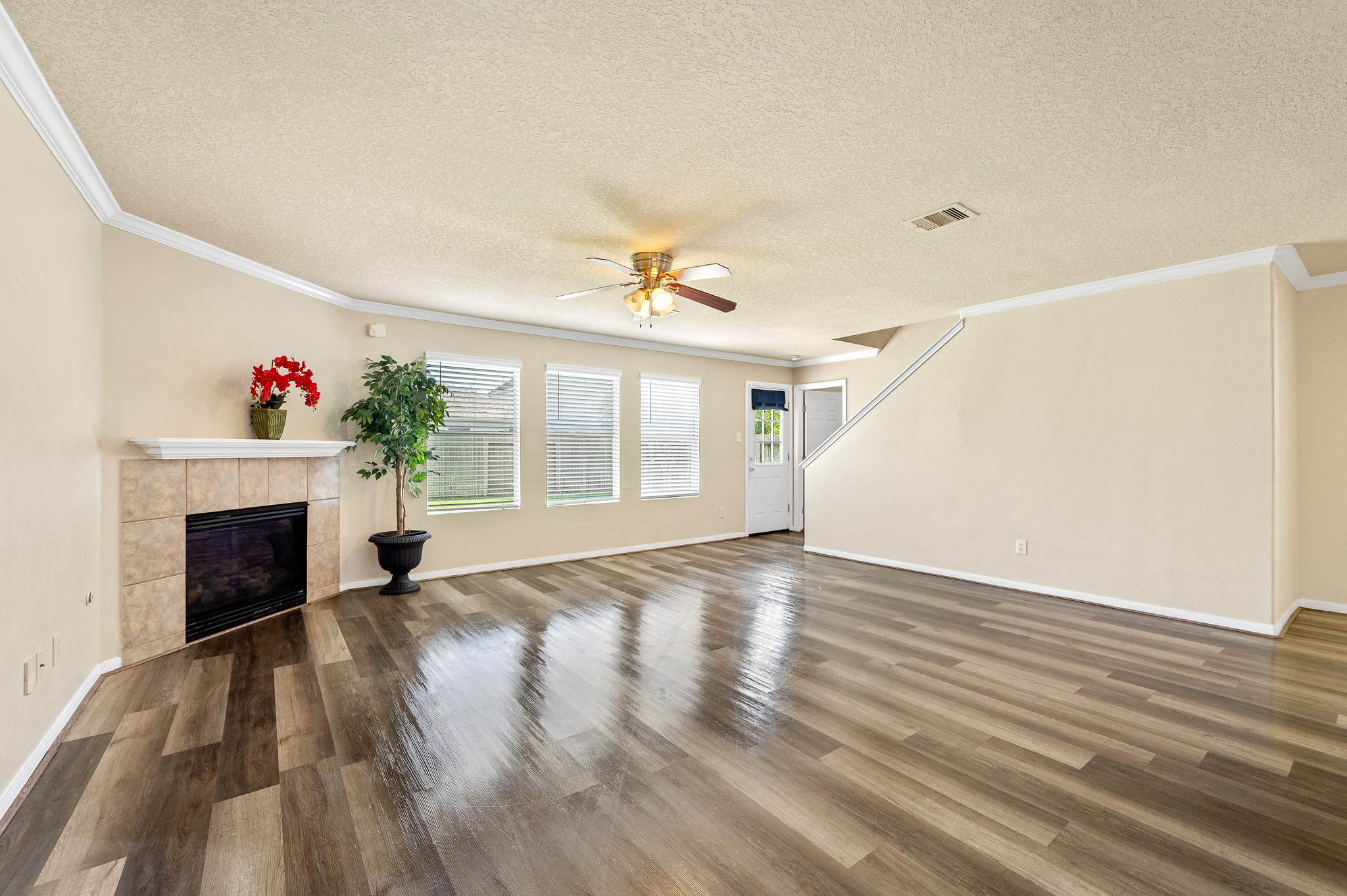 3234 Clipper Winds Way Houston, TX 77084 - Photo 4 of 46 a view of an empty room with wooden floor and a window