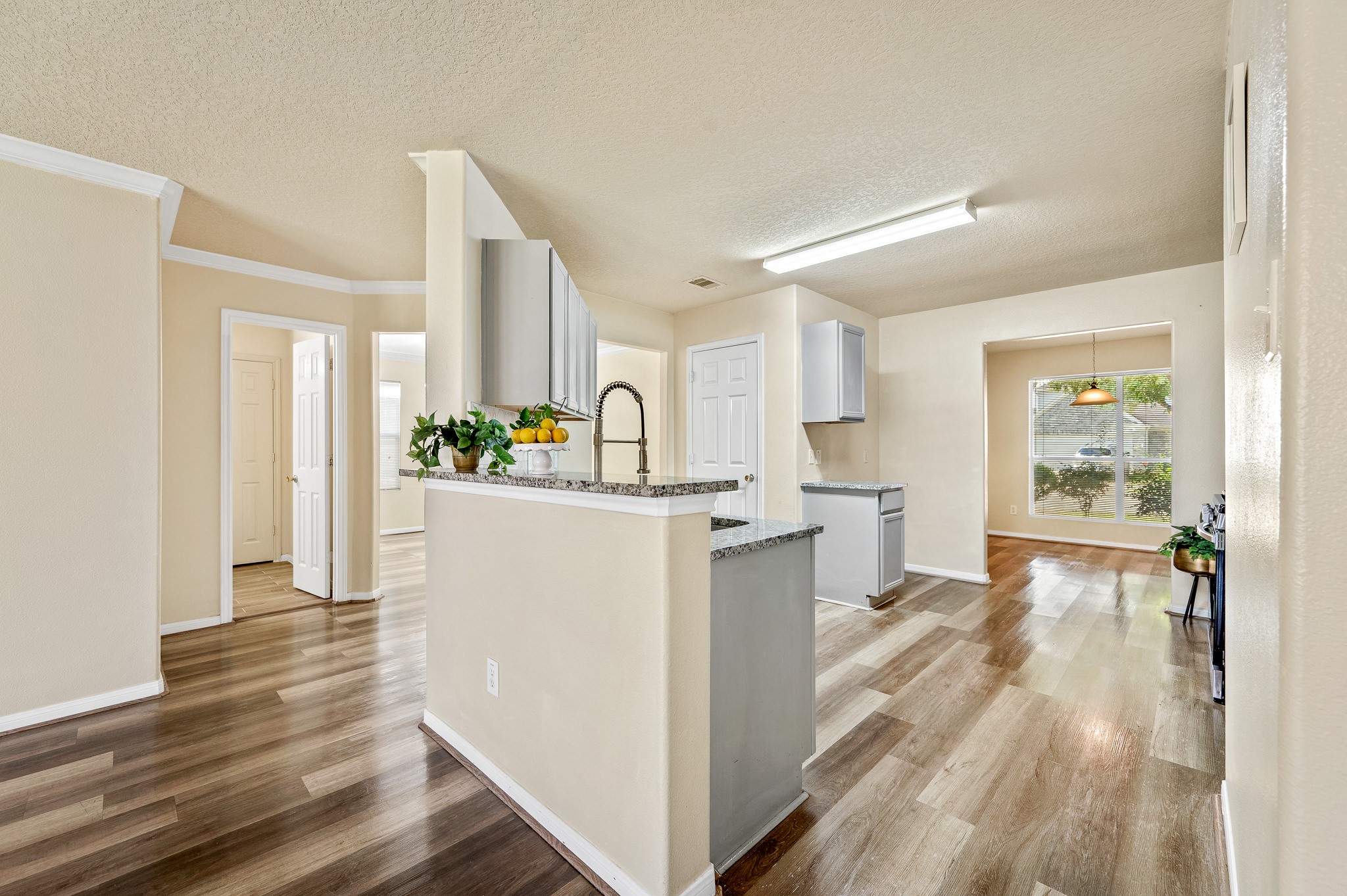 3234 Clipper Winds Way Houston, TX 77084 - Photo 9 of 46 a view of kitchen with furniture and wooden floor