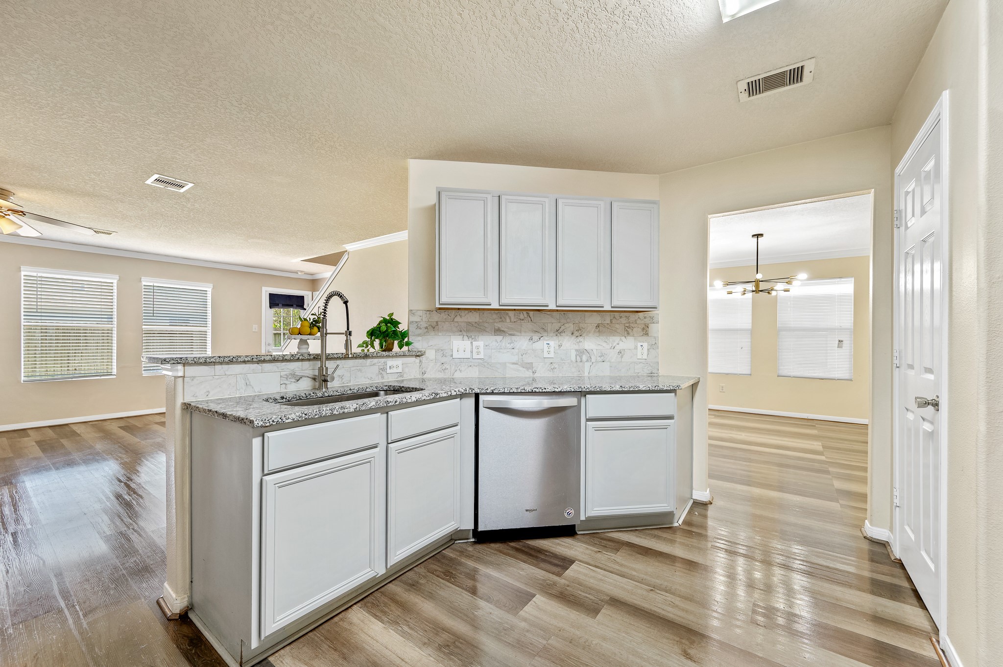 3234 Clipper Winds Way Houston, TX 77084 - Photo 10 of 46 a kitchen with granite countertop a sink and cabinets