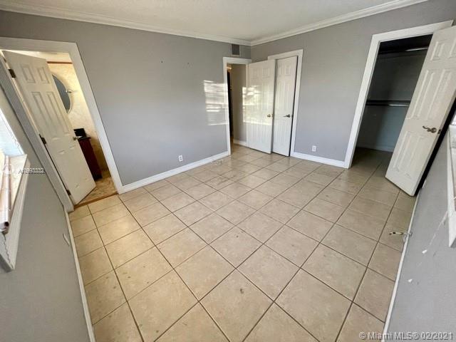 2008 Jackson Street, Unit C7 Hollywood, FL 33020 - Photo 17 of 24 a view of an empty room and wooden floor