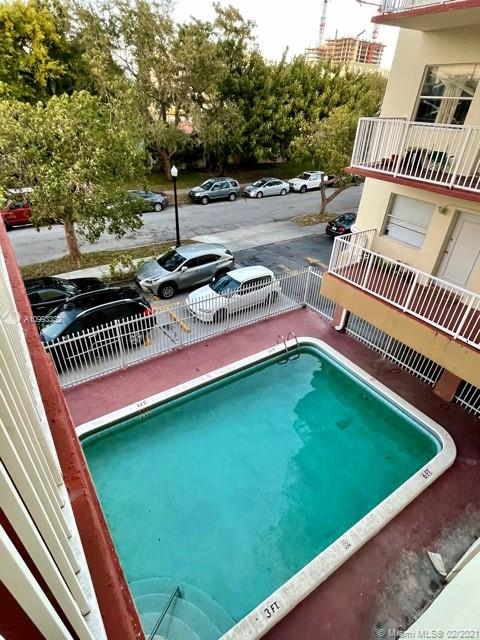 2008 Jackson Street, Unit C7 Hollywood, FL 33020 - Photo 20 of 24 a view of swimming pool from a balcony