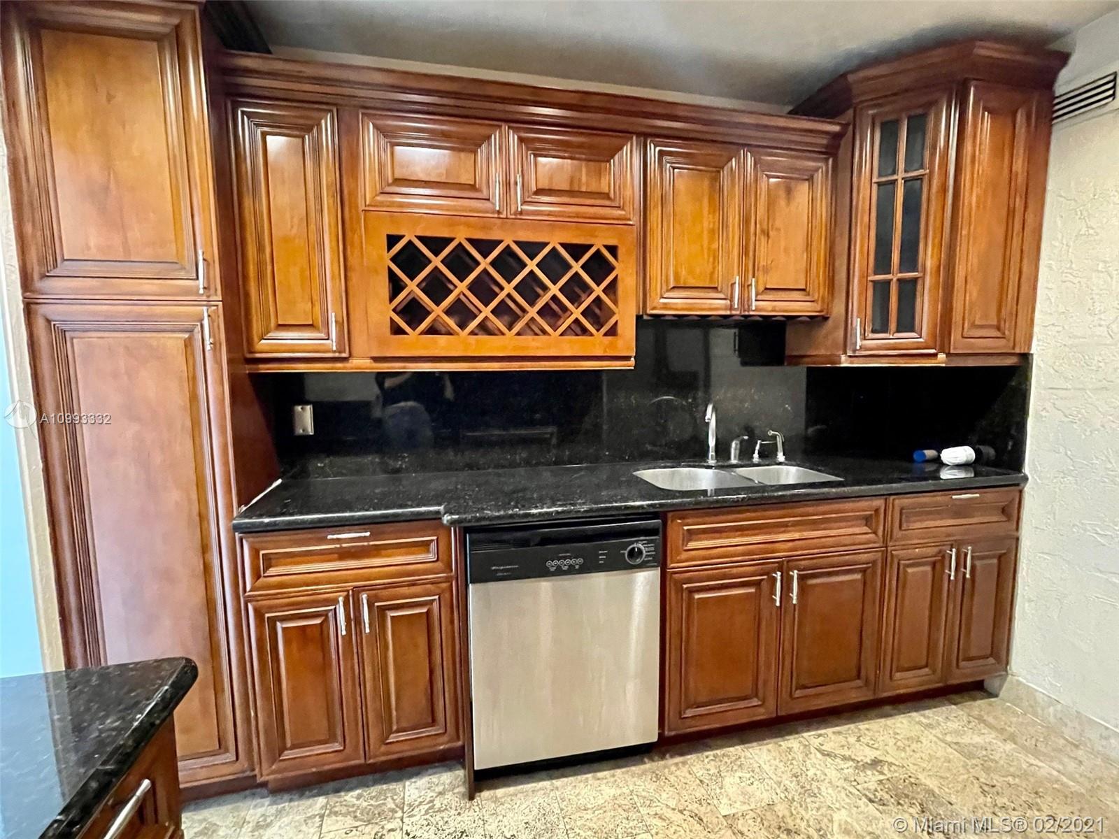 2008 Jackson Street, Unit C7 Hollywood, FL 33020 - Photo 3 of 24 a kitchen with granite countertop a sink and a stove