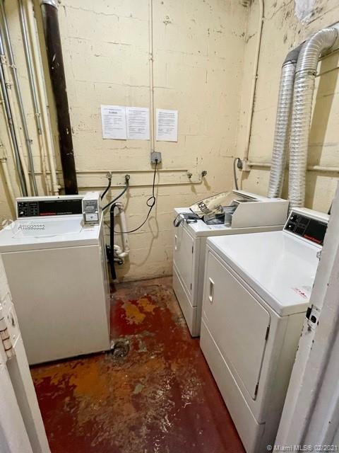 2008 Jackson Street, Unit C7 Hollywood, FL 33020 - Photo 21 of 24 a utility room with dryer and washer