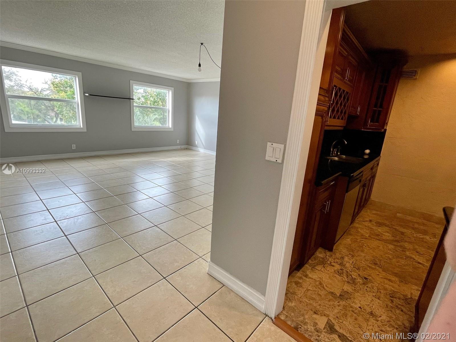 2008 Jackson Street, Unit C7 Hollywood, FL 33020 - Photo 6 of 24 a view of an empty room and window