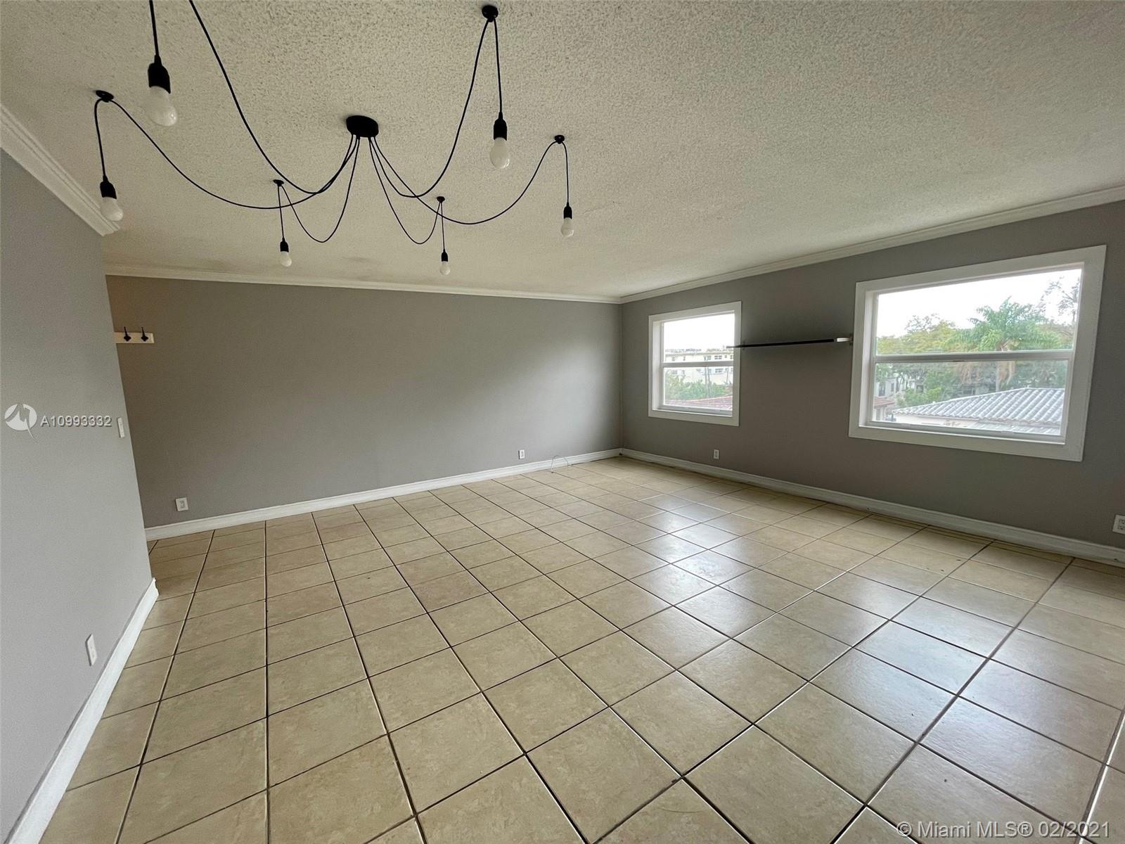 2008 Jackson Street, Unit C7 Hollywood, FL 33020 - Photo 7 of 24 a view of an empty room and window