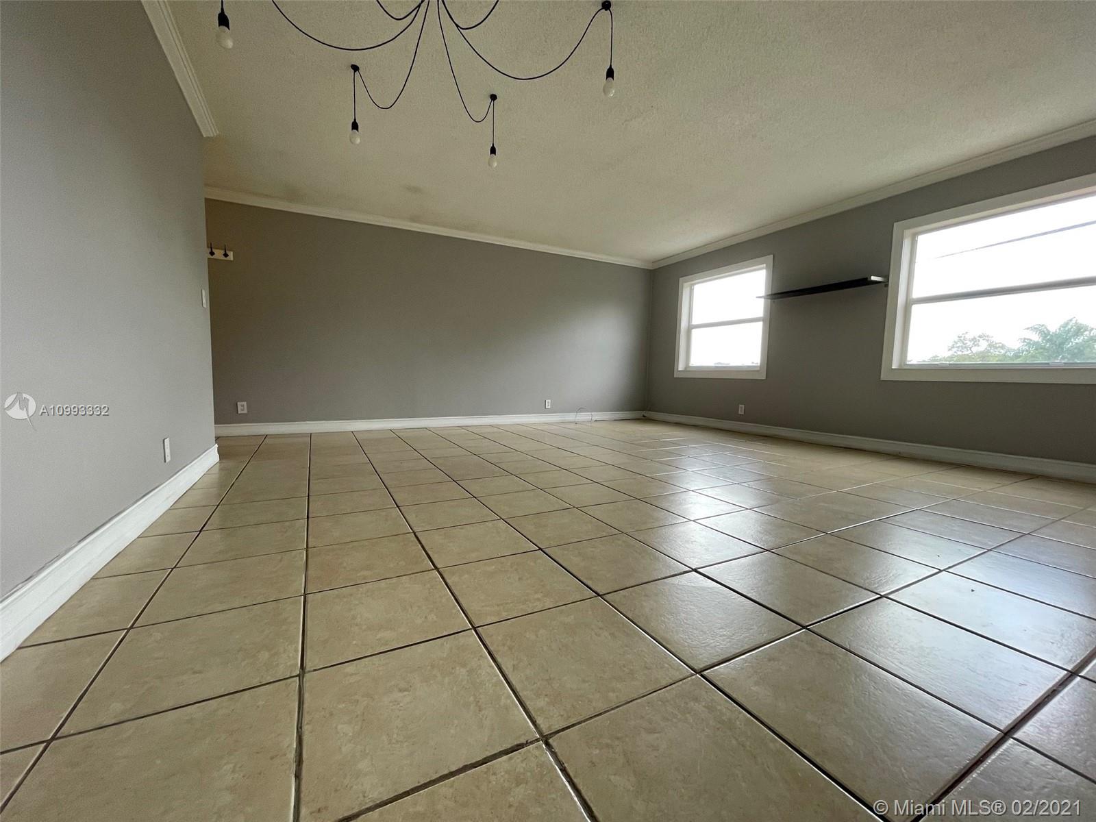 2008 Jackson Street, Unit C7 Hollywood, FL 33020 - Photo 8 of 24 a view of an empty room with a window