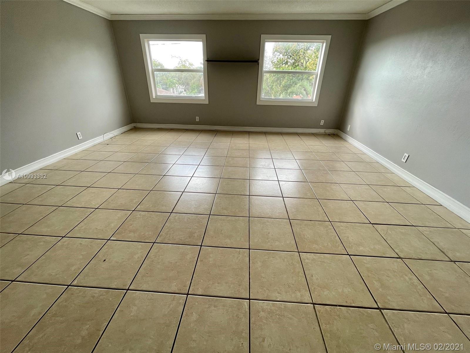 2008 Jackson Street, Unit C7 Hollywood, FL 33020 - Photo 9 of 24 a view of an empty room and window