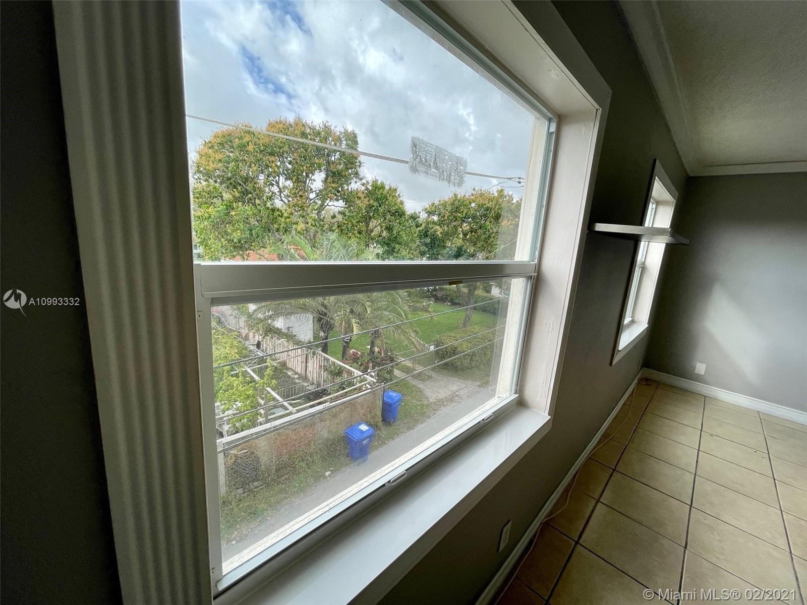 2008 Jackson Street, Unit C7 Hollywood, FL 33020 - Photo 10 of 24 a view of a balcony with an outdoor space