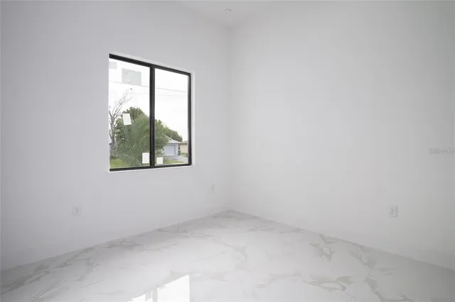 a bathroom with a sink toilet a mirror and shower