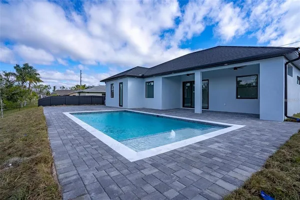 a view of swimming pool with outdoor seating