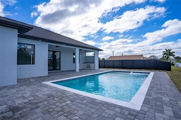 a view of swimming pool with a yard