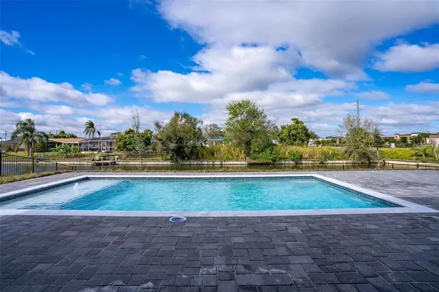 an aerial view of a house with a lake view