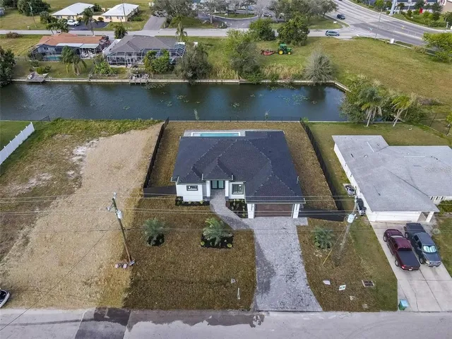 an aerial view of a house with outdoor space