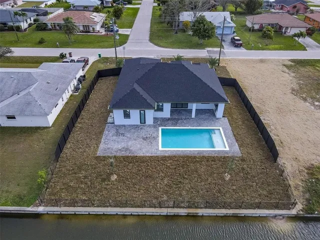 a view of a lake with a houses in the background