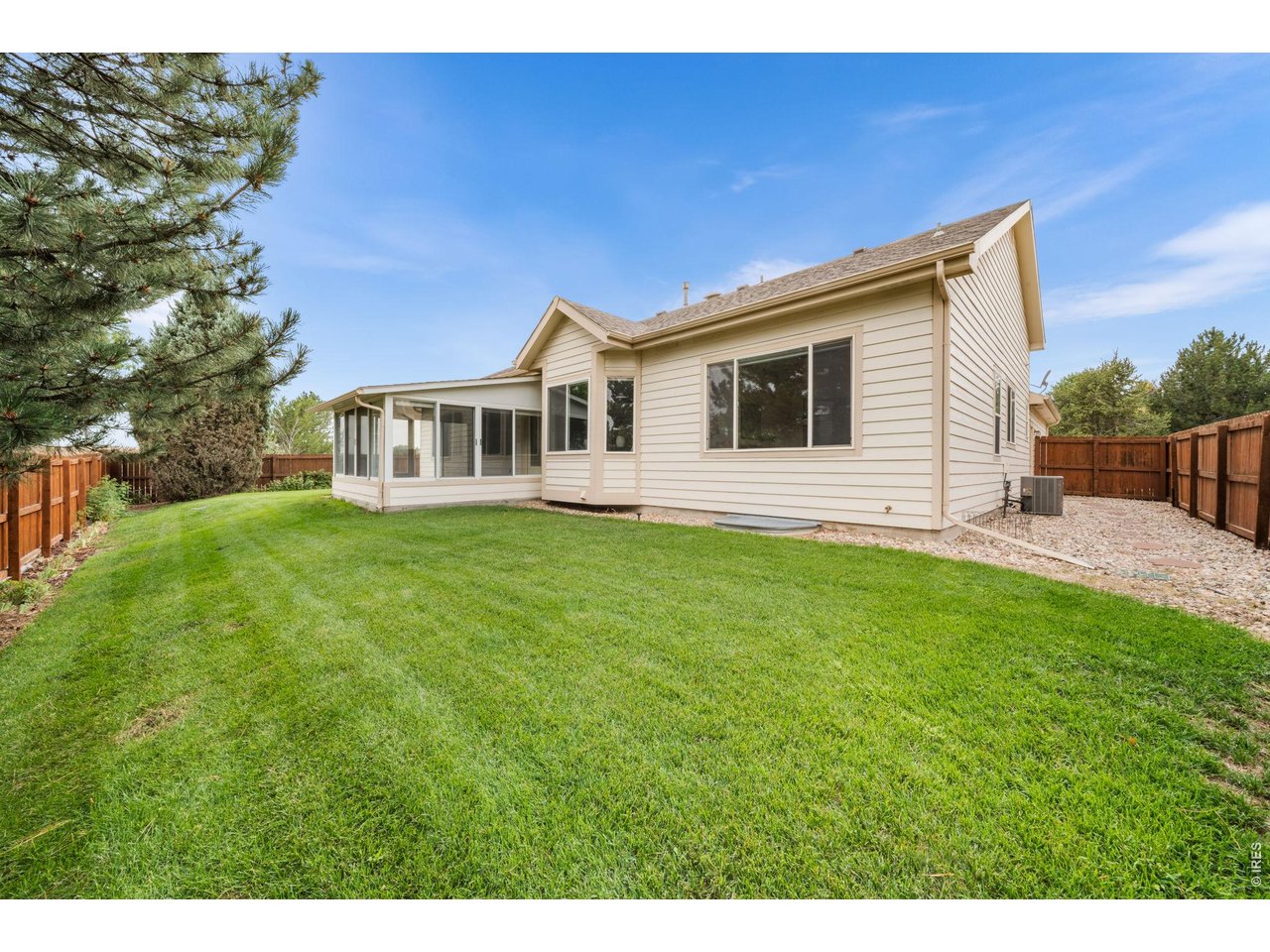4014 Carrick Road Fort Collins, CO 80525 - Photo 29 of 41 Back exterior and lawn