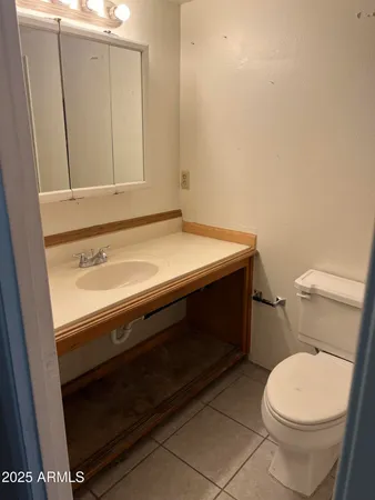 a white bath tub sitting next to a toilet