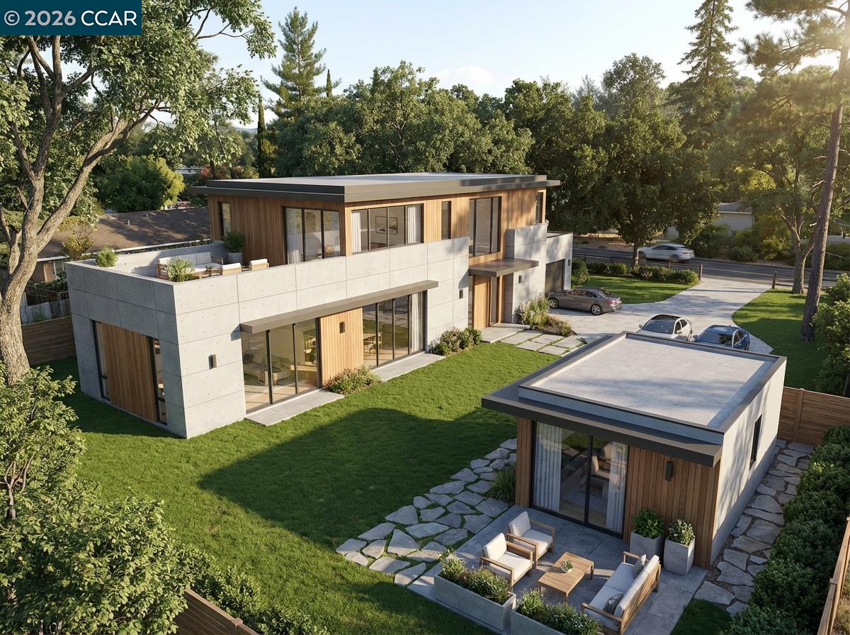a view of a house with backyard and sitting area