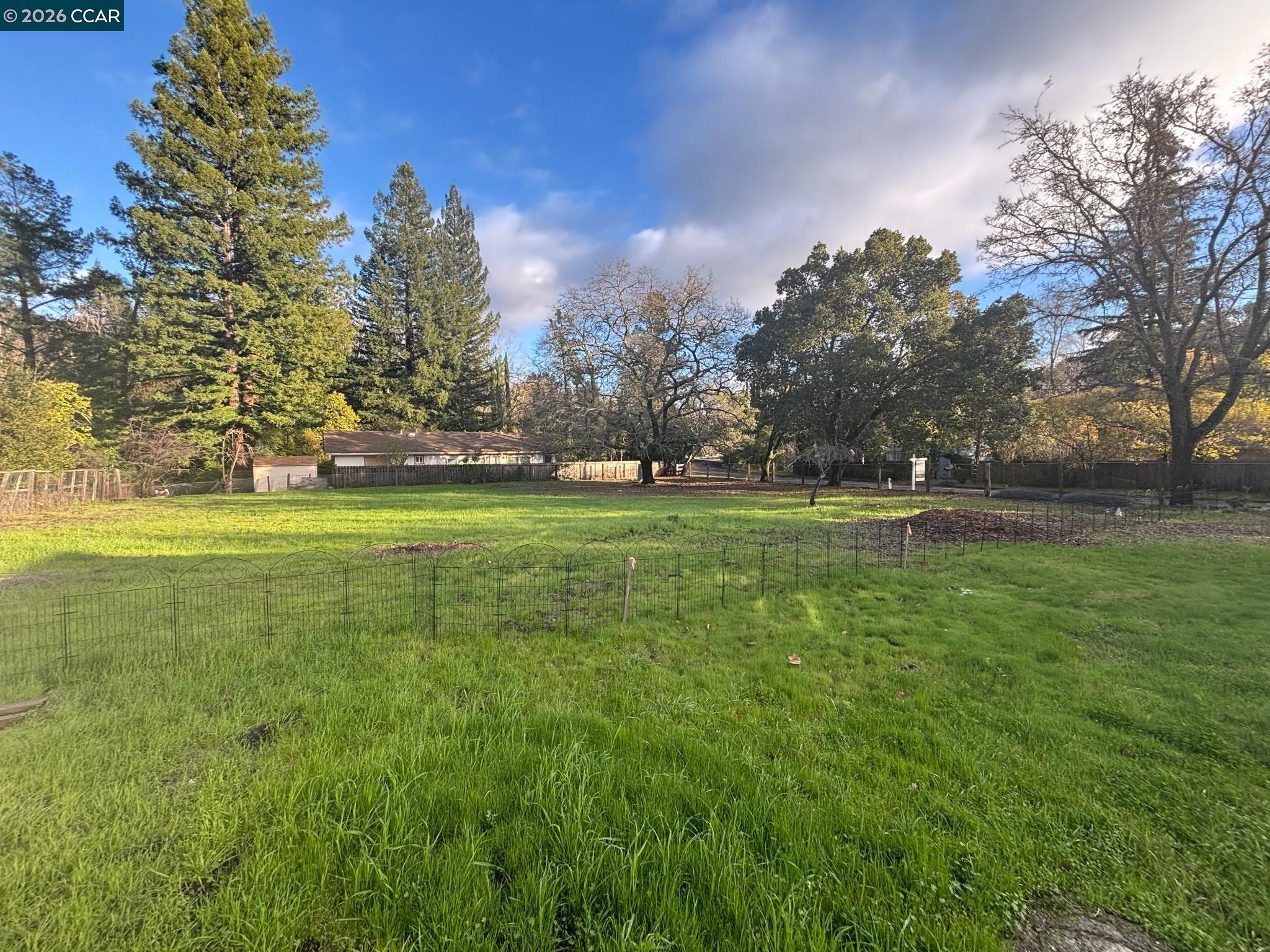 3894 El Nido Ranch Road Lafayette, CA 94549 - Photo 12 of 22 a backyard of apartments with large trees