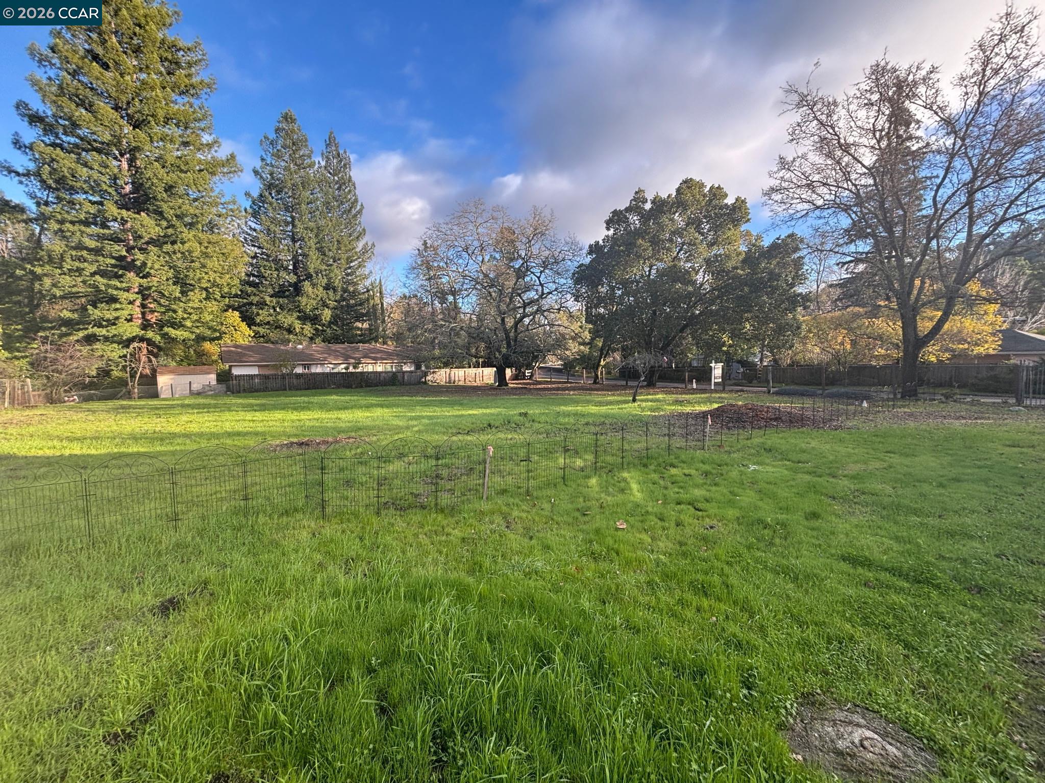 3894 El Nido Ranch Road Lafayette, CA 94549 - Photo 2 of 22 a backyard of apartments with large trees