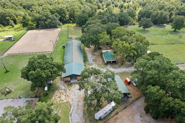 an aerial view of a house with a garden