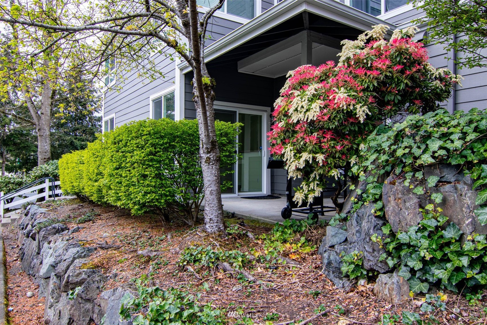 3901 243rd Place Southeast, Unit O102 Bothell, WA 98021 - Photo 17 of 32 a front view of a house with plants