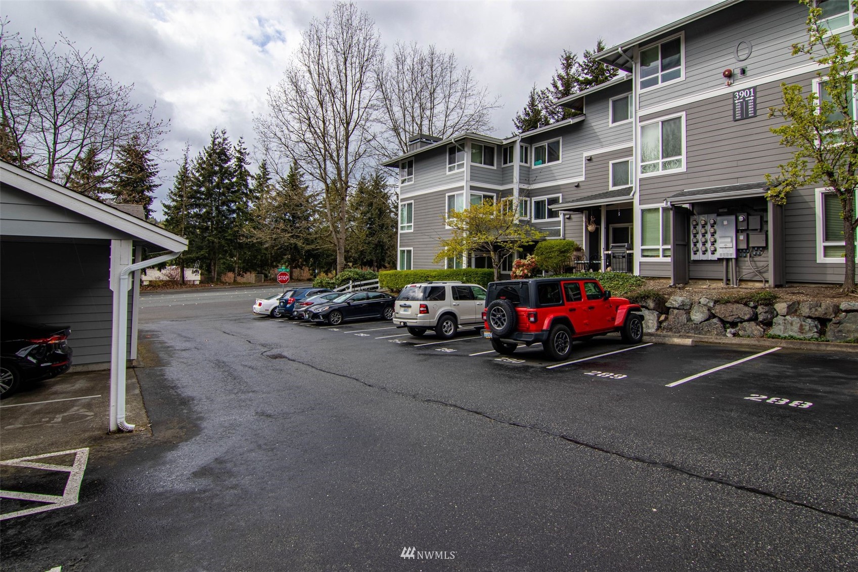 3901 243rd Place Southeast, Unit O102 Bothell, WA 98021 - Photo 2 of 32 a view of a street with cars